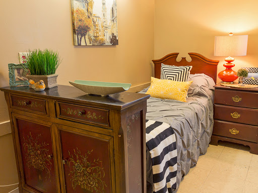 A cozy and stylish bedroom featuring elegant furniture, decorative accents, and a warm atmosphere.