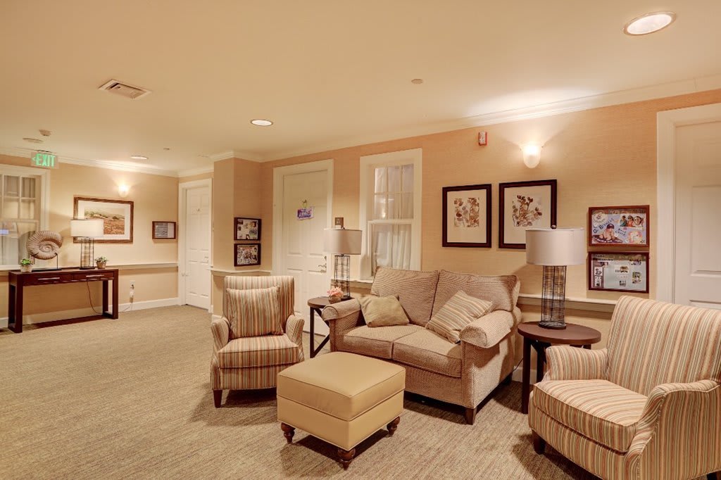 A cozy living room with comfortable seating and warm lighting.