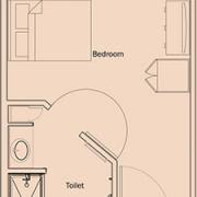 A simple floor plan featuring a bedroom and a toilet.