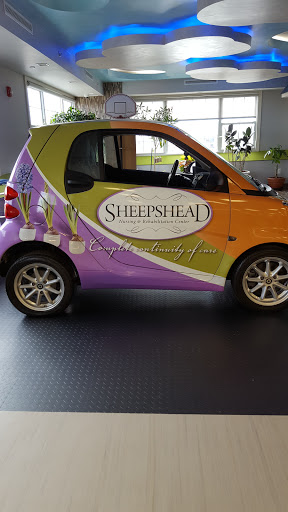 A creatively designed smart car featuring vibrant colors and branding for a business.