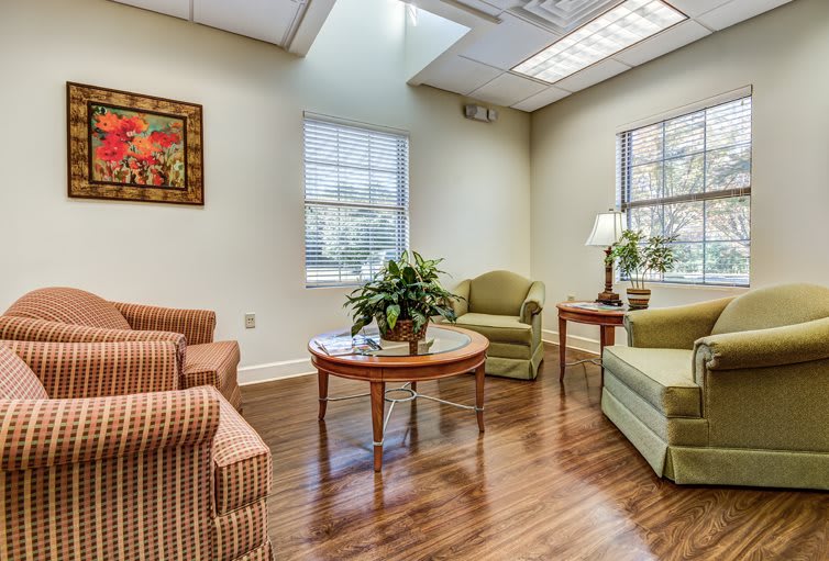 A cozy waiting room with comfortable seating and natural light.