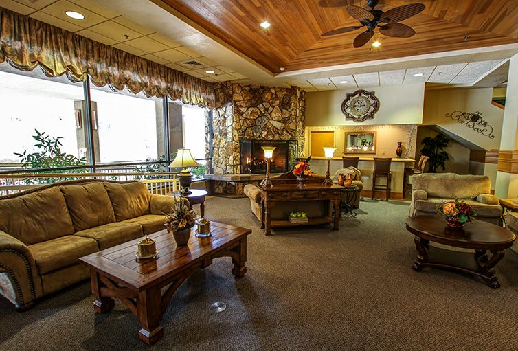 A cozy living room interior with comfortable seating and warm decor.