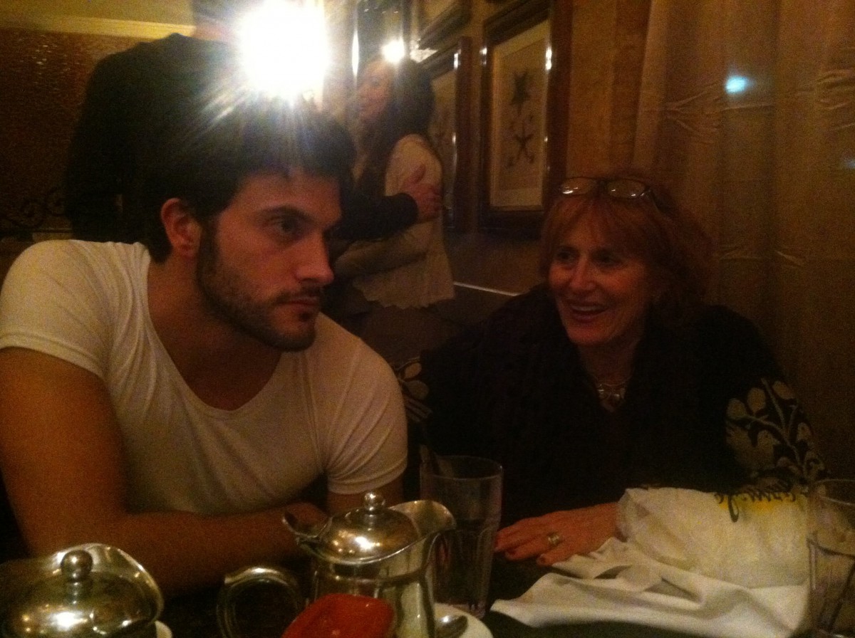 Two people enjoying a conversation at a restaurant table.