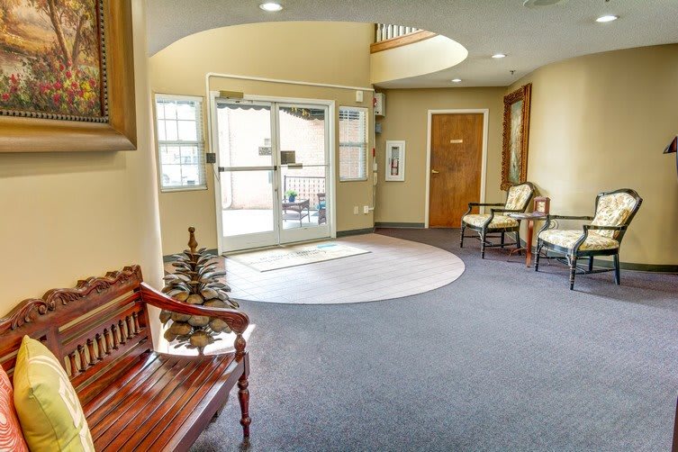 A cozy waiting area with seating and natural light.