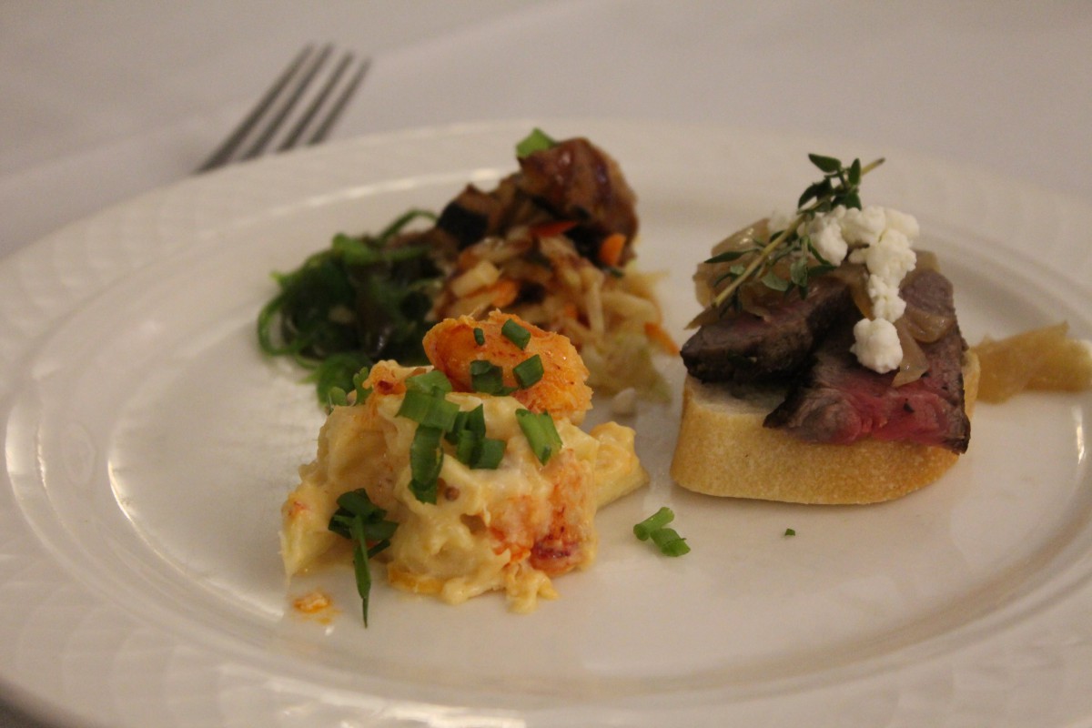 A gourmet plate featuring a trio of elegant appetizers.