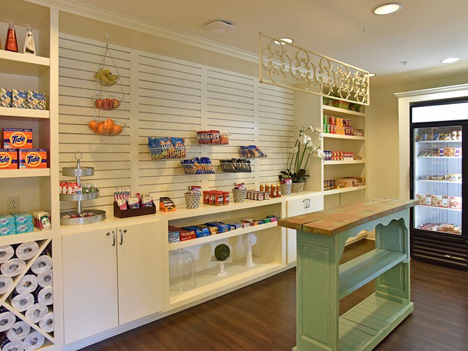 A well-organized candy shop interior with neatly arranged shelves and colorful products.