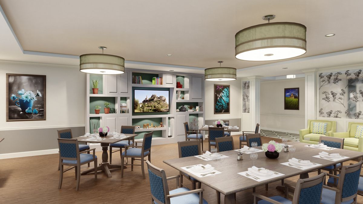 A modern dining area featuring stylish furniture and elegant lighting.