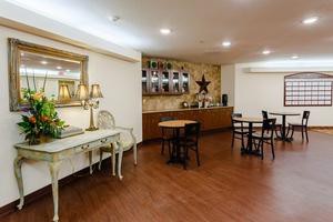 A cozy dining area with elegant decor and warm lighting.
