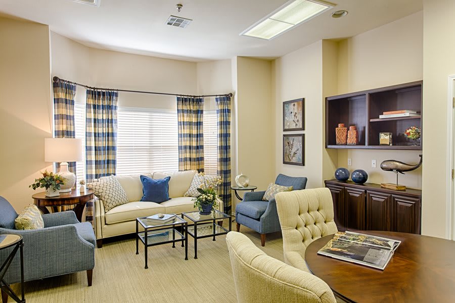 A cozy living room with comfortable seating and elegant decor.