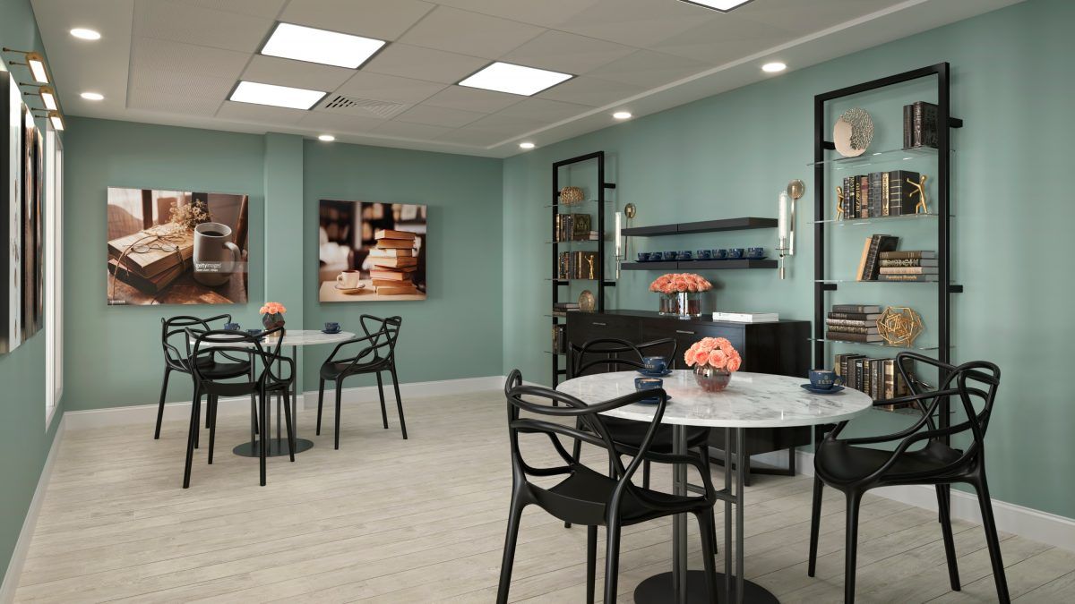 A modern cafe interior with stylish decor and seating arrangements.