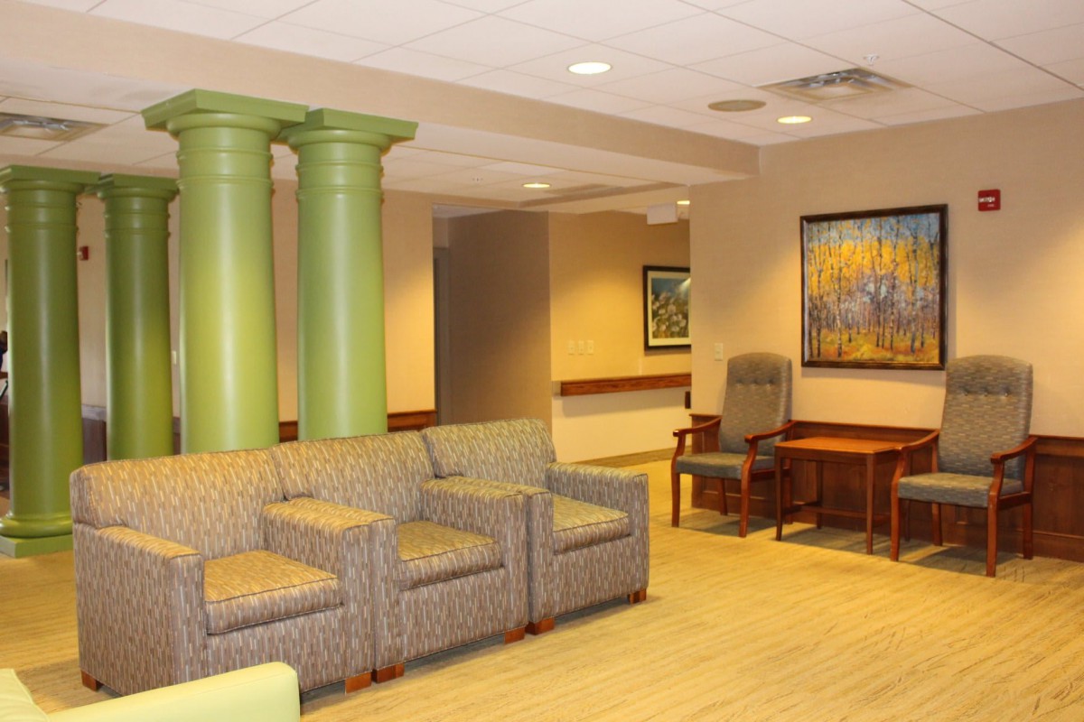 A welcoming waiting room with comfortable seating and colorful artwork.