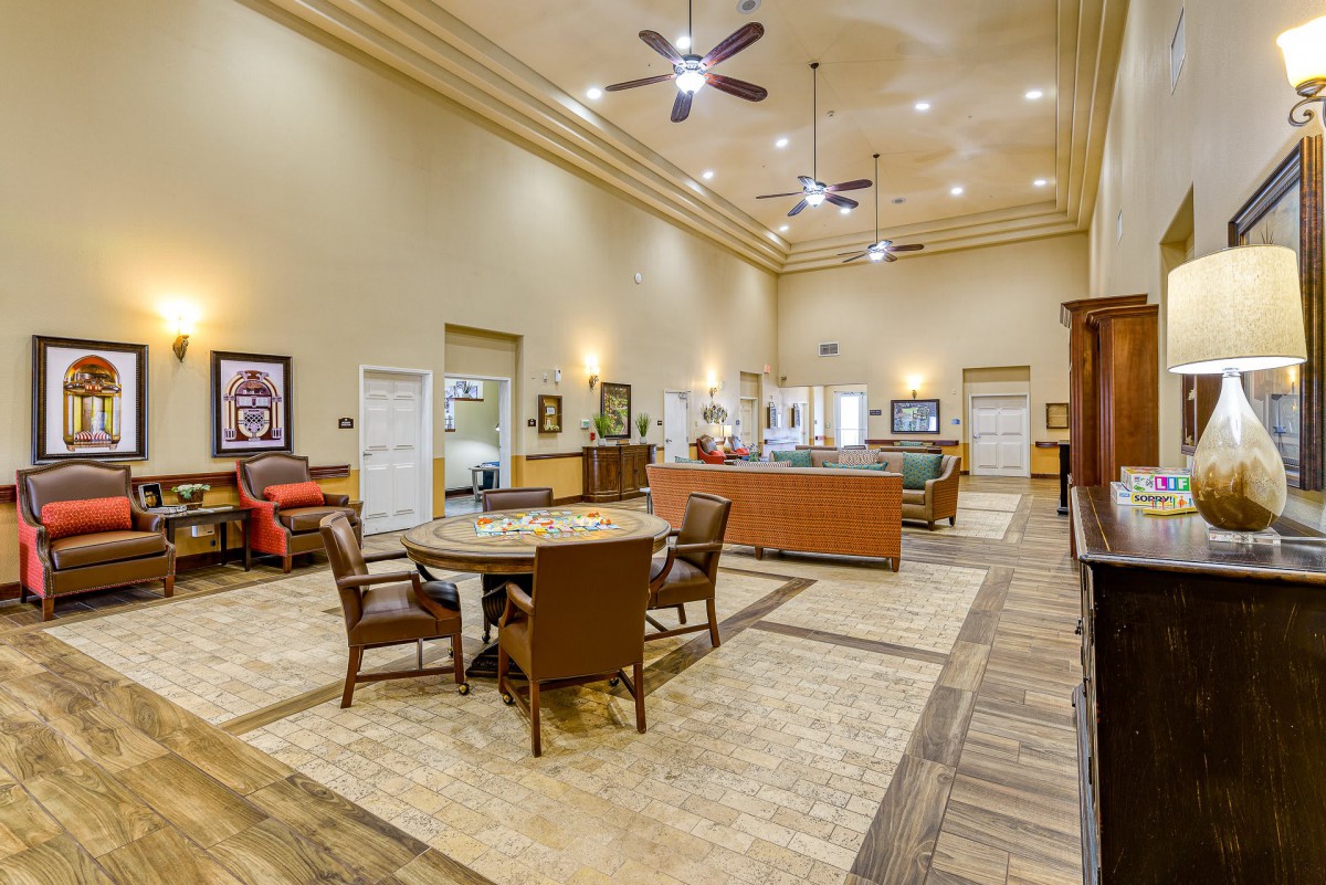 A spacious lobby with comfortable seating and a reception area.