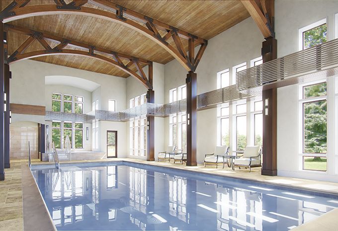 A spacious indoor pool area with wooden beams and large windows.