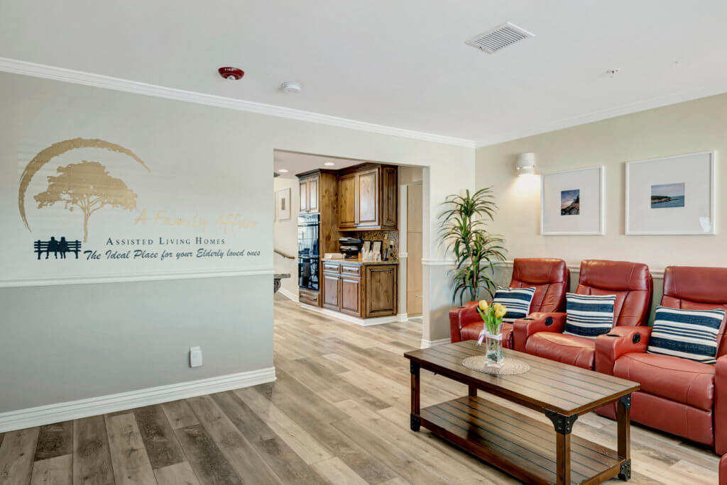 A cozy living room with red armchairs, a wooden coffee table, and a welcoming atmosphere.