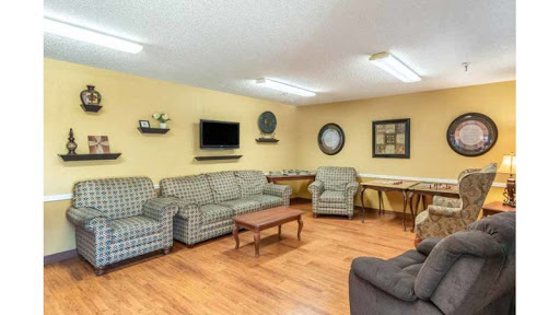 A cozy and inviting living room setup featuring comfortable sofas and a TV, ideal for relaxation.
