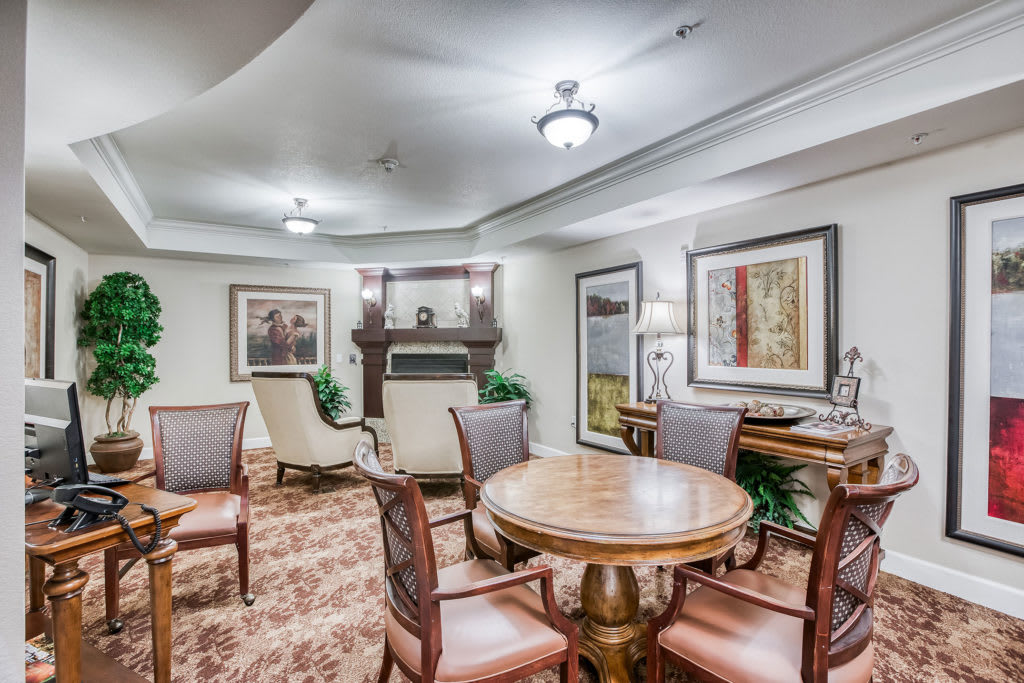 A cozy and elegant living room with classic furniture and tasteful artwork.