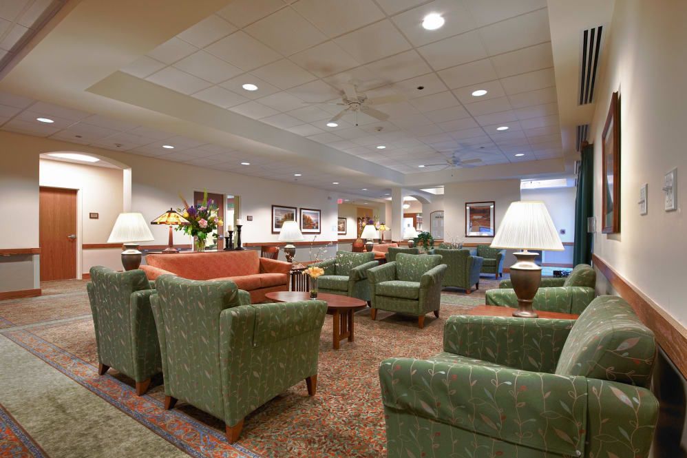 A well-appointed lobby featuring comfortable seating and warm lighting.