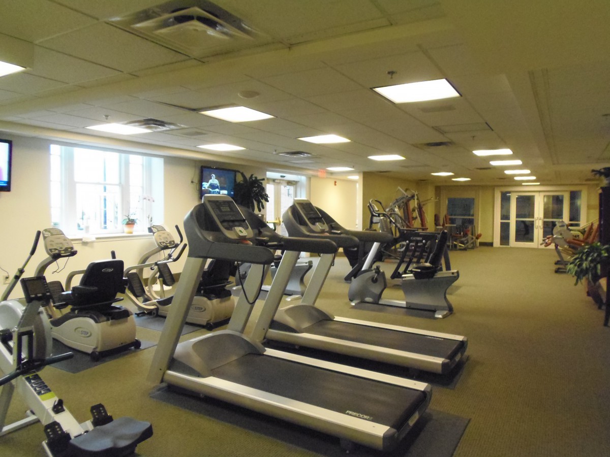 A spacious gym with treadmills and various exercise equipment.