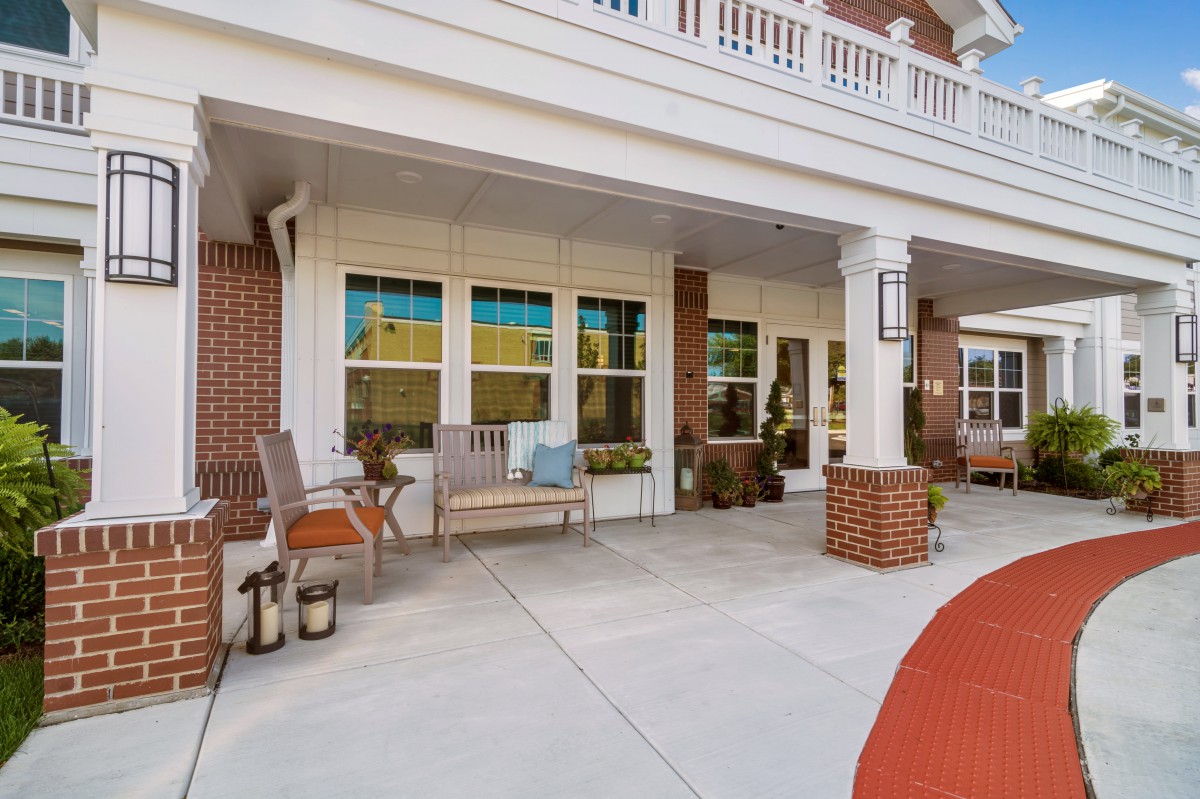 A welcoming porch with seating and decorative elements.