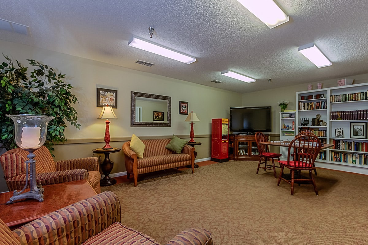 A cozy living room with comfortable seating, a TV, and tasteful decor.