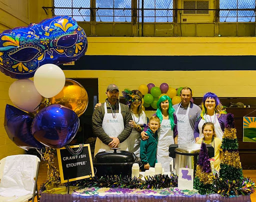 A joyful gathering at a community event, featuring festive decorations and enthusiastic participants.