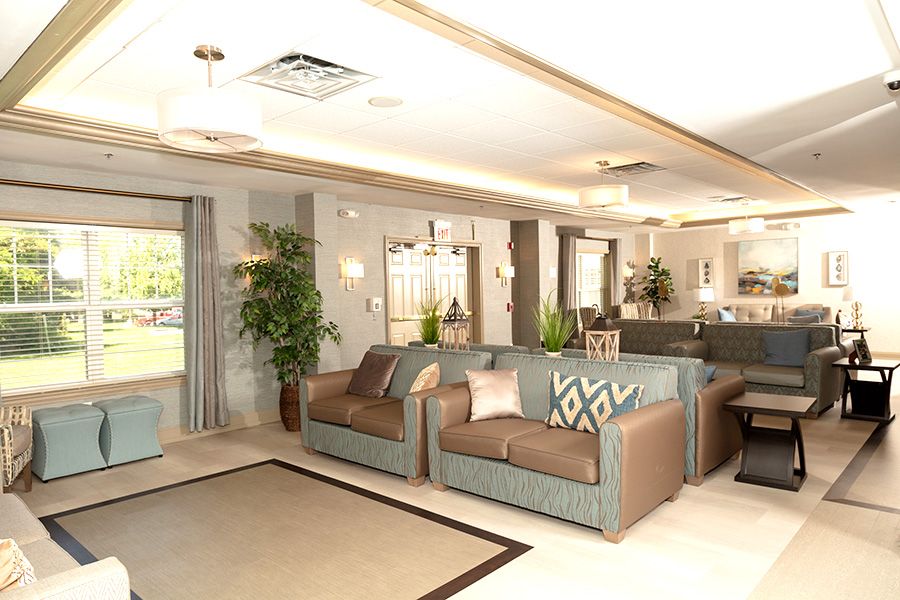 A modern and spacious living room with elegant furniture and neutral color accents.