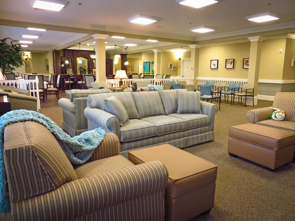 A spacious and well-lit lobby area with comfortable sofas and chairs arranged for relaxation.