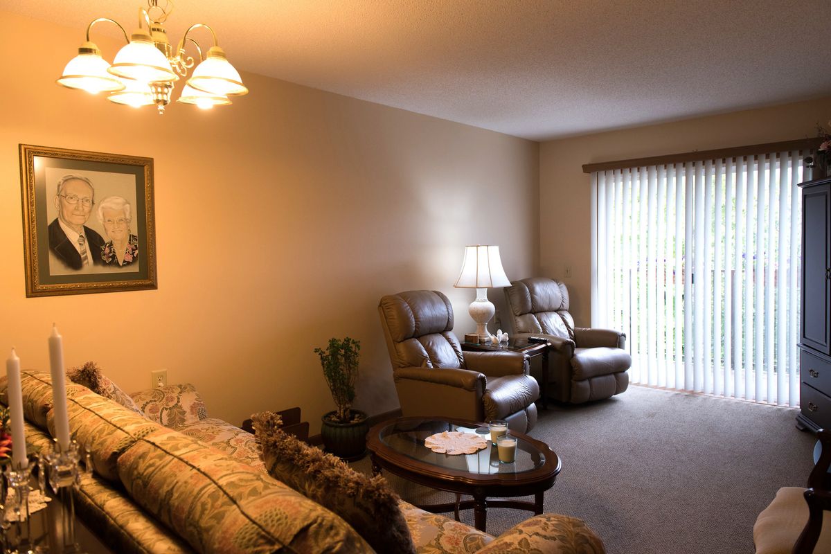 A cozy living room with comfortable seating and soft lighting.