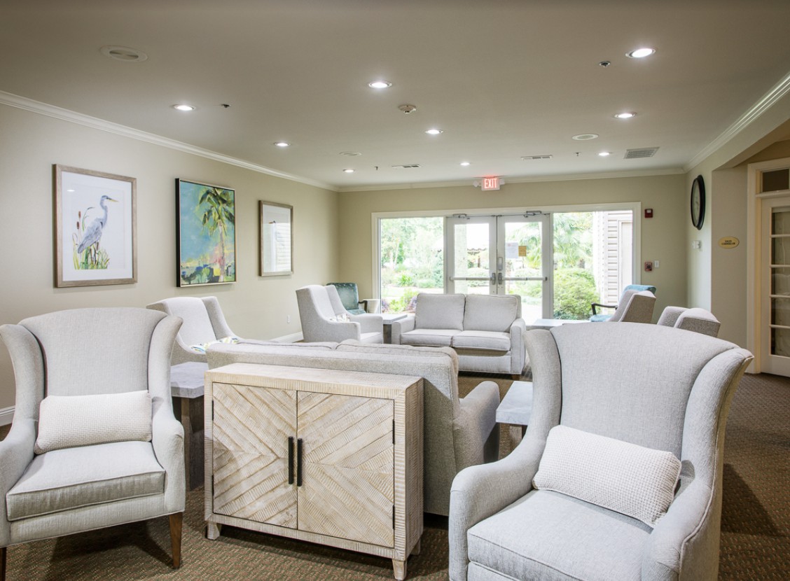 A modern living room with comfortable seating and natural light.
