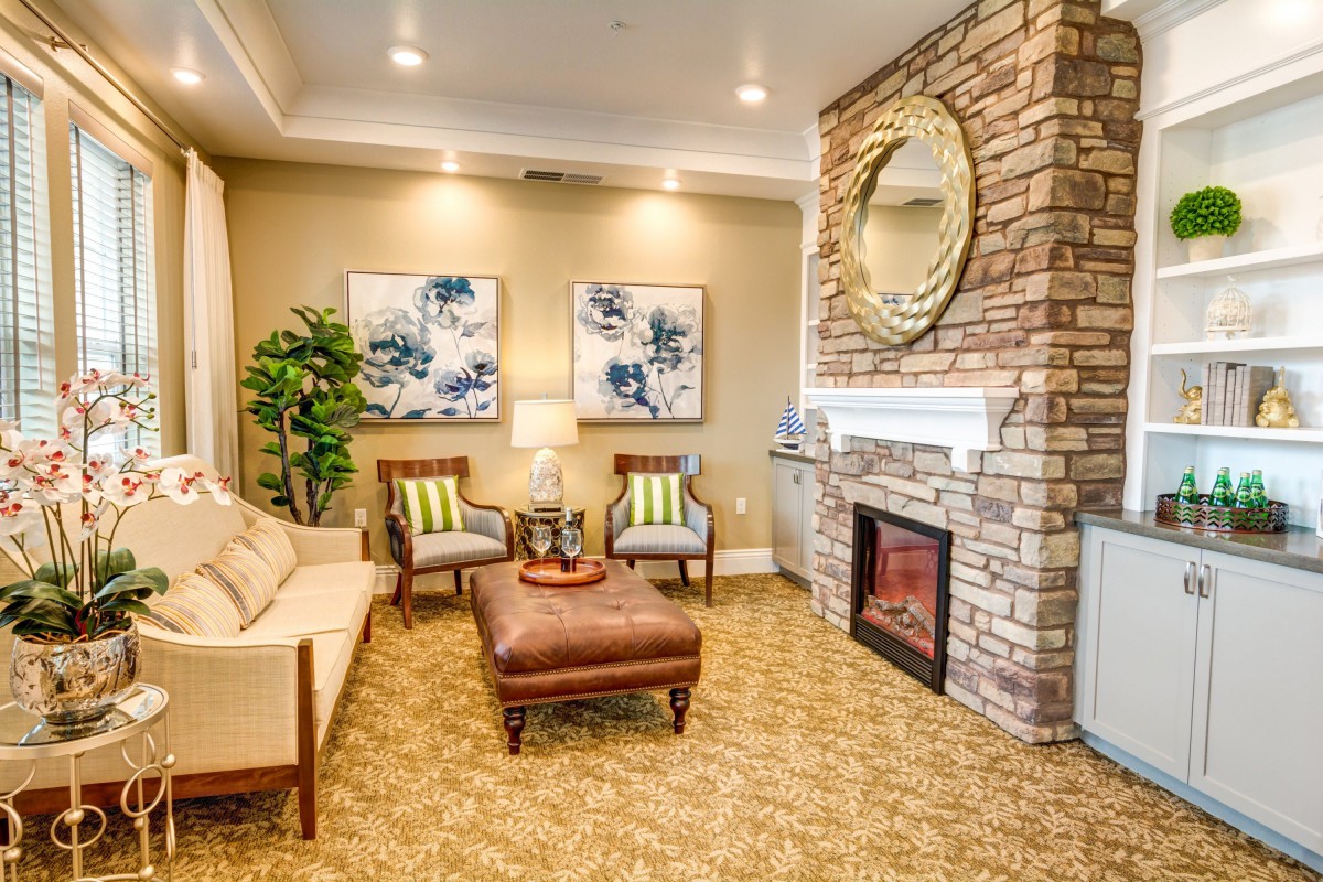 A cozy living room with a fireplace and elegant decor.