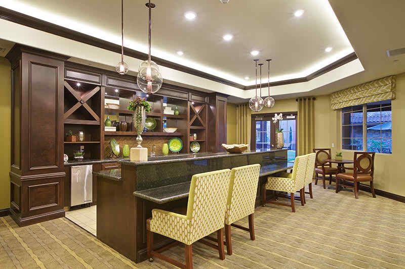 A modern kitchen bar area with elegant lighting and stylish decor.
