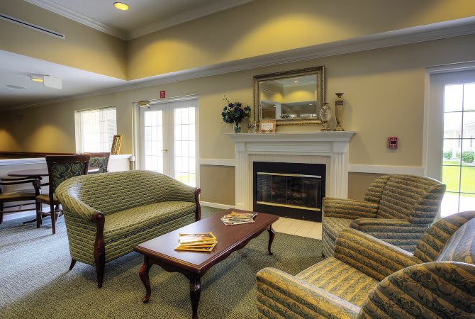 A cozy living room with comfortable seating and a fireplace.
