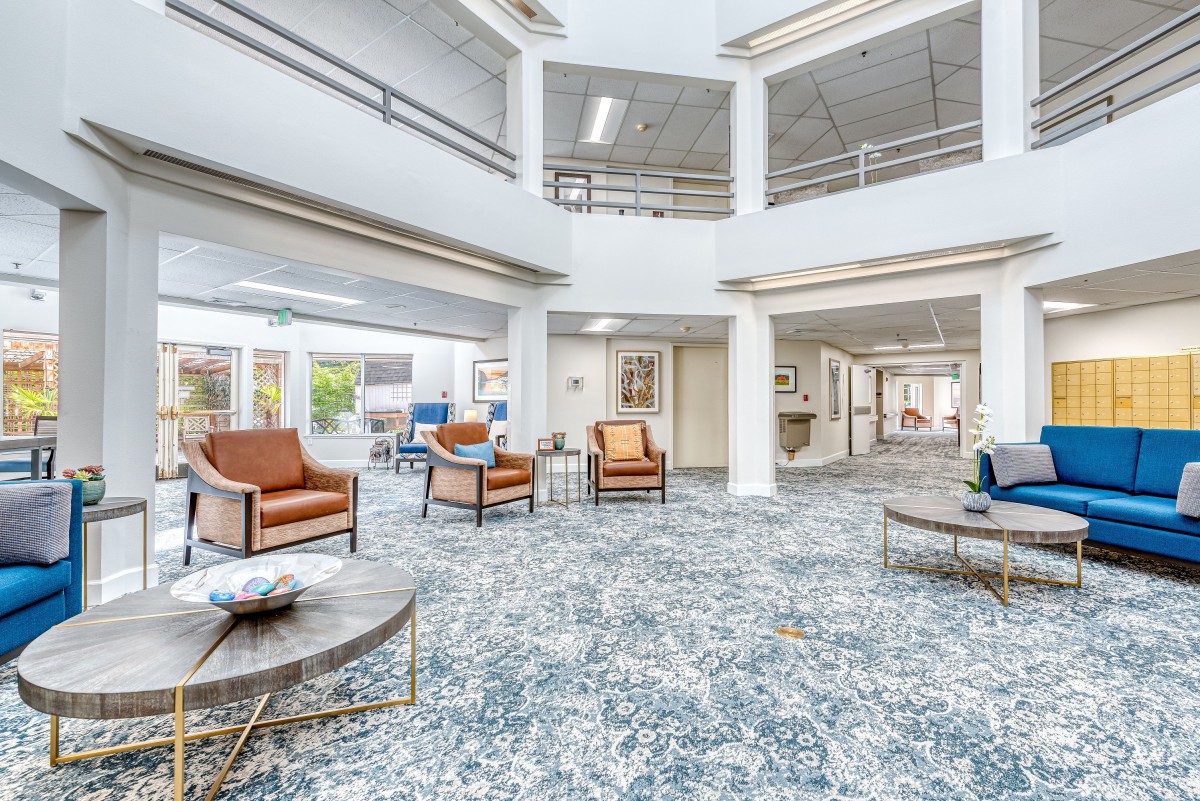 A spacious and modern lobby with comfortable seating and elegant interior design.