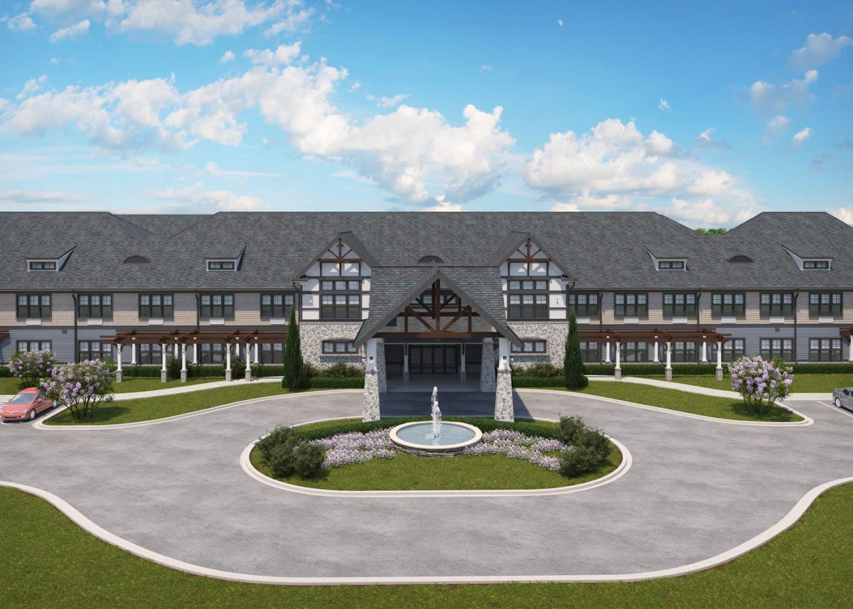 A large, elegant building with a central fountain and circular driveway.