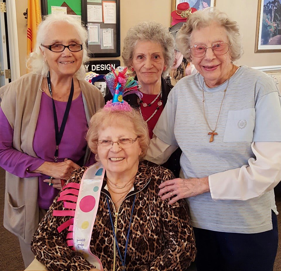 A group of elderly women celebrating a birthday.