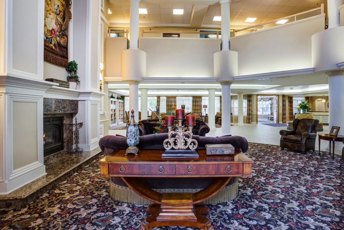 A spacious and elegantly decorated lobby with comfortable seating and ornate furnishings.