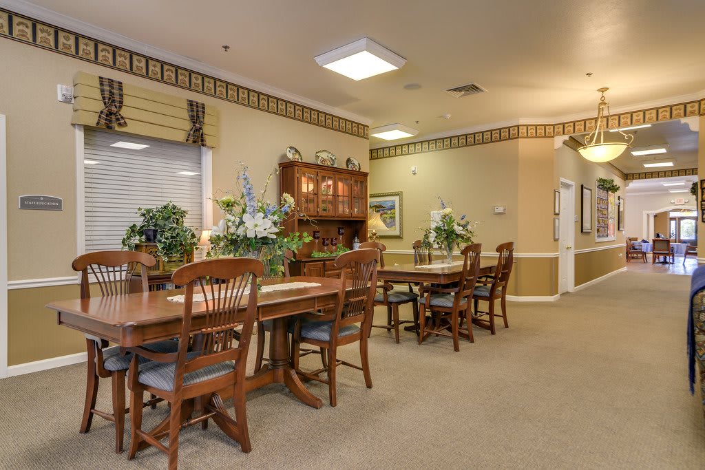 A cozy dining area with wooden furniture and elegant decor.