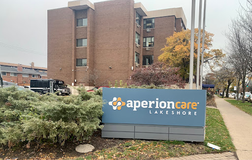 Entrance of Aperion Care Lansdowne with autumn scenery.
