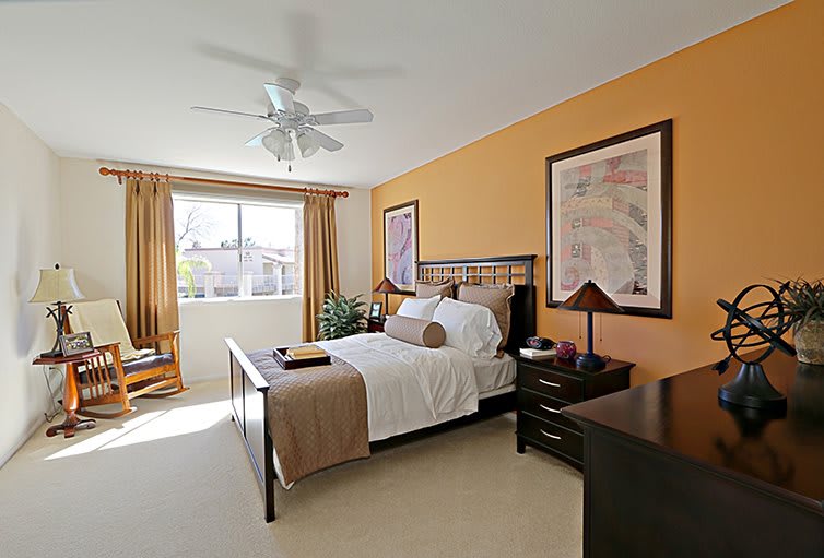 A cozy and modern bedroom with warm colors and stylish decor.