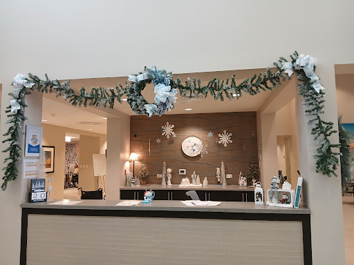 A beautifully decorated reception area featuring a holiday wreath and elegant decor.