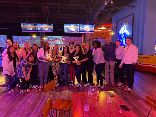 A fun night out with friends at the bowling alley, celebrating together!