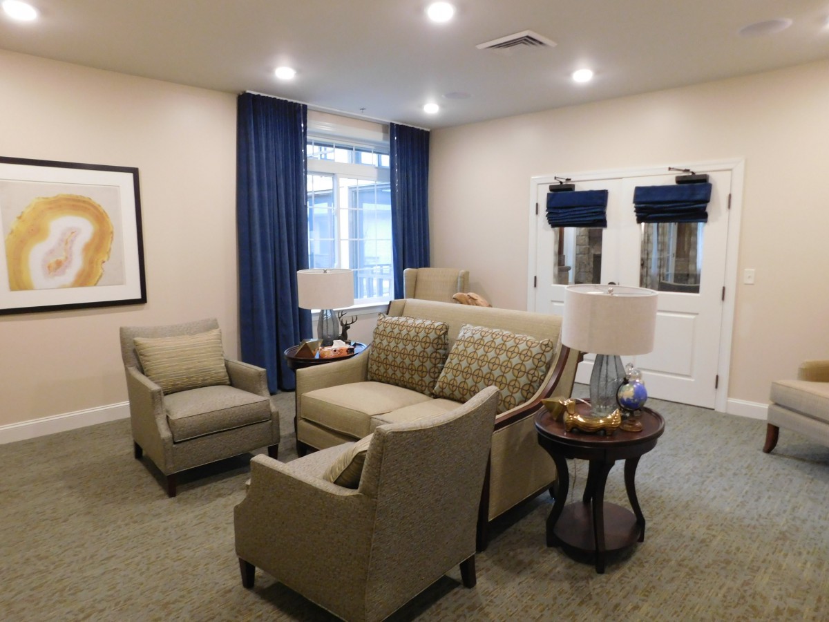 A cozy living room with comfortable seating and soft lighting.