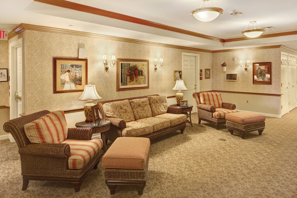 A cozy living room with elegant furniture and warm lighting.