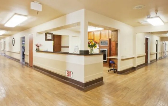 A modern reception area with wood flooring and a welcoming design.