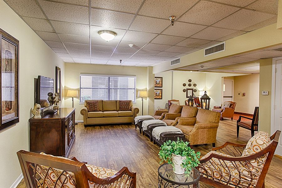 A cozy living room with comfortable seating and warm lighting.