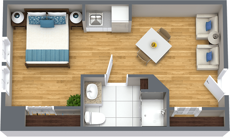 A compact studio apartment floor plan featuring a combined bedroom and kitchen area, with an adjacent bathroom.