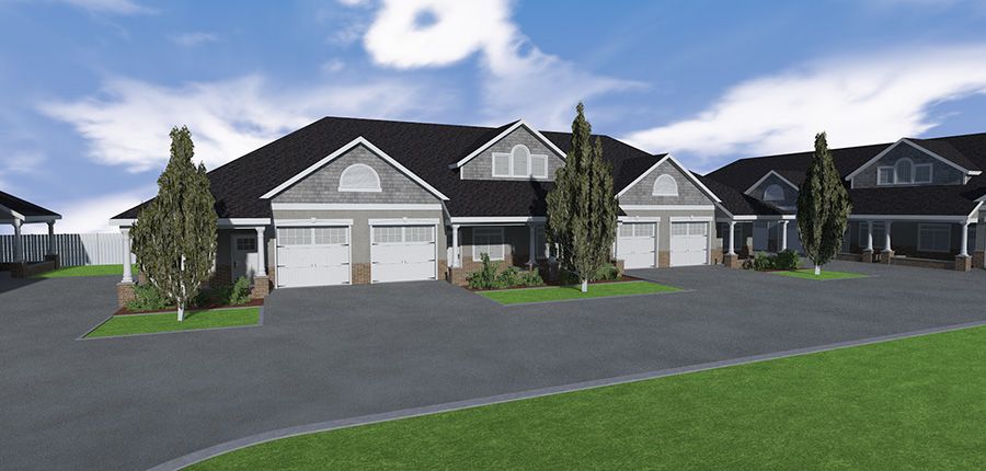 A suburban duplex with two garages and a driveway.
