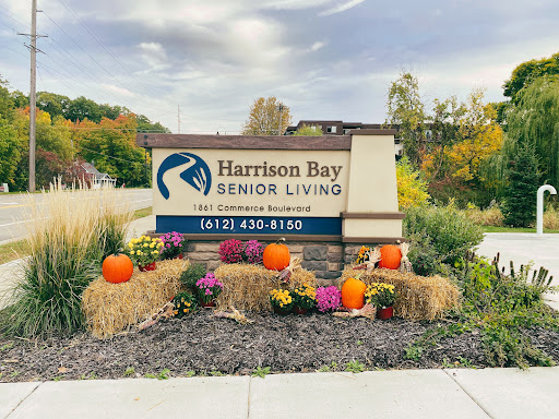 Welcome to Harrison Bay Senior Living, a community adorned with fall decorations.