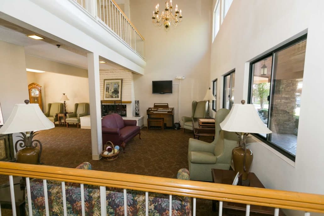 Spacious living room with high ceilings and comfortable seating.