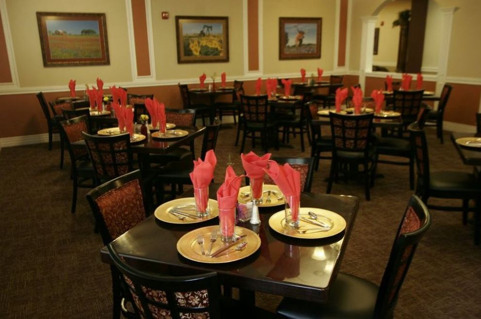 An elegantly arranged restaurant dining area with tables set for guests.